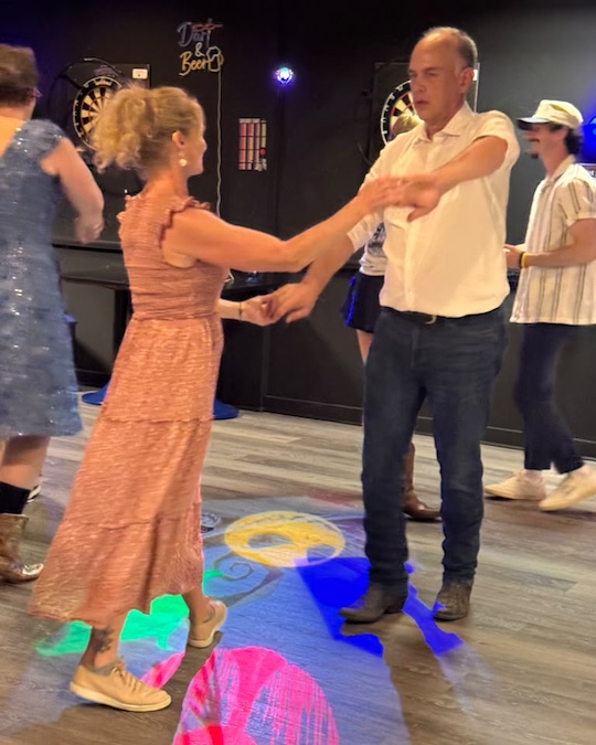Rodeo Swing Maine dancers on the wood dance floor