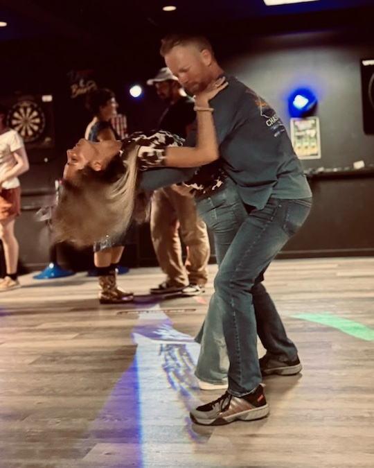Couples dancing country swing in Portland Maine